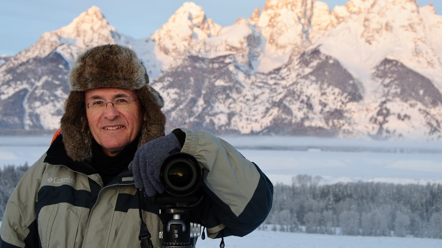 Howard Ignatius with his camera in front of the Teton Range in winter